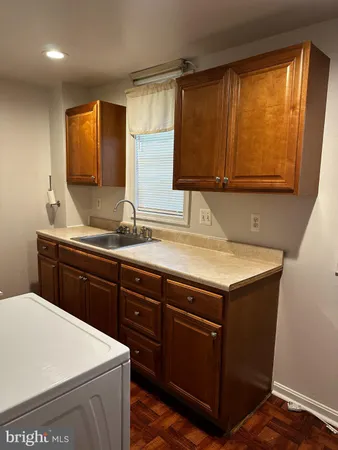 a kitchen with a sink and a window