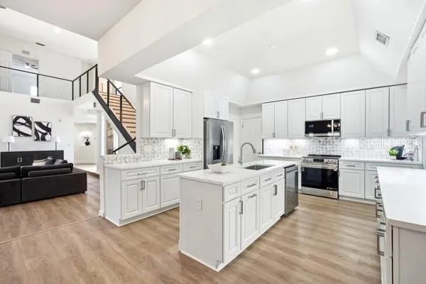 a view of a livingroom with furniture and a patio