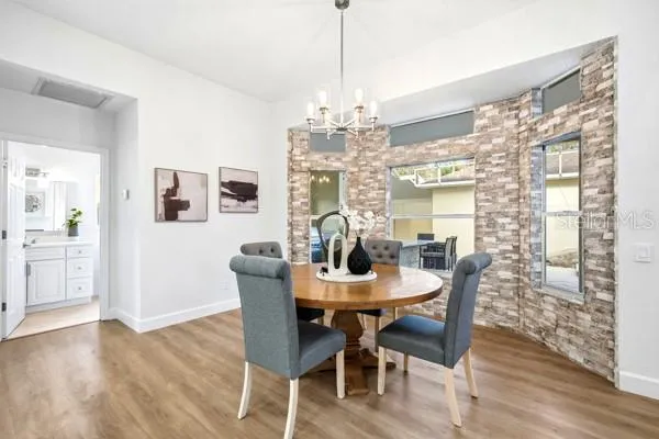 a spacious bathroom with a granite countertop tub shower and sink