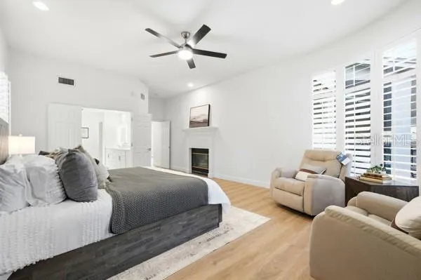 a bathroom with a sink toilet double vanity and shower