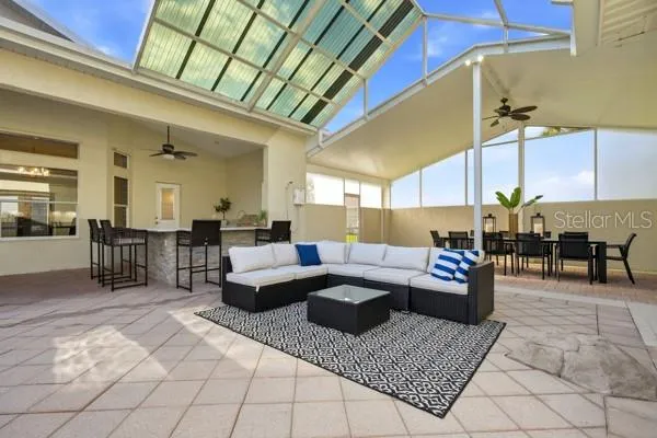 an aerial view of a house with yard swimming pool and outdoor seating