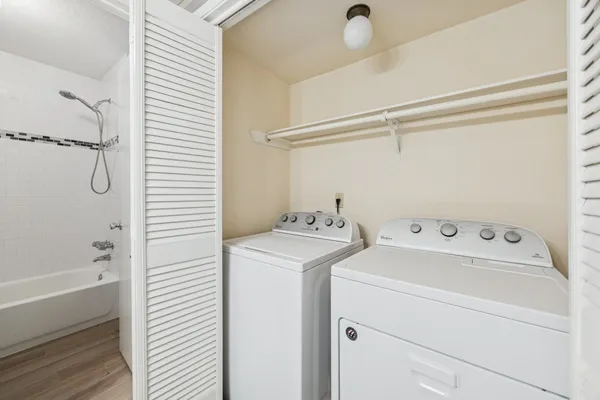 a view of bathroom with washer and dryer