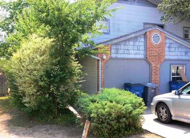 a view of a house with a cars park