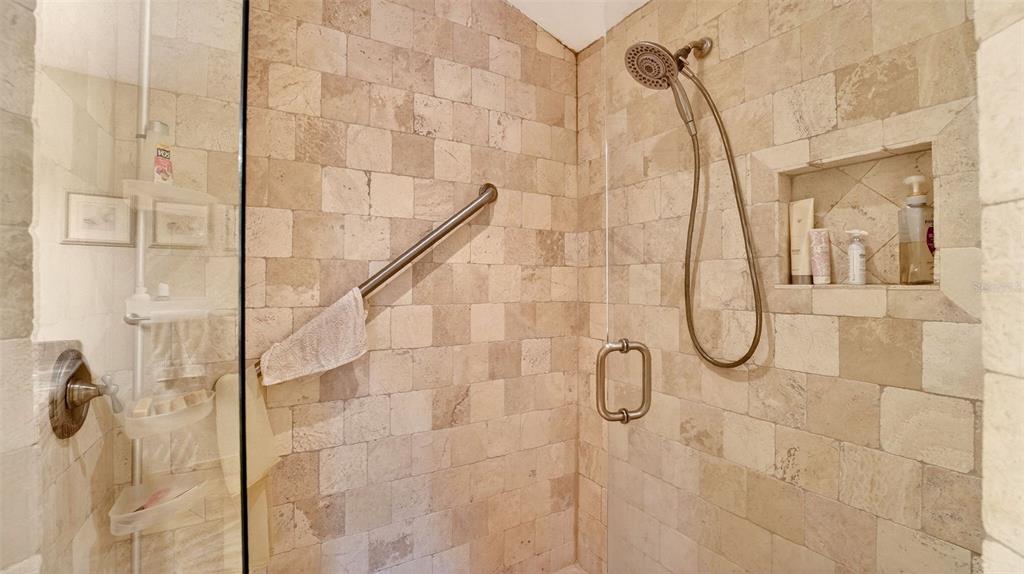 1100 South Riverside Drive Edgewater, FL 32132 - Photo 35 of 57 a bathroom with a glass shower door