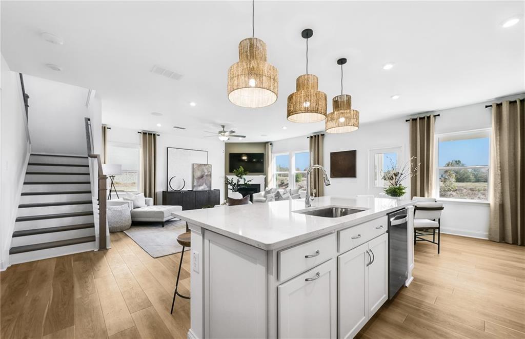2102 Cayman Court Dacula, GA 30019 - Photo 3 of 18 a kitchen with a sink stainless steel appliances and furniture
