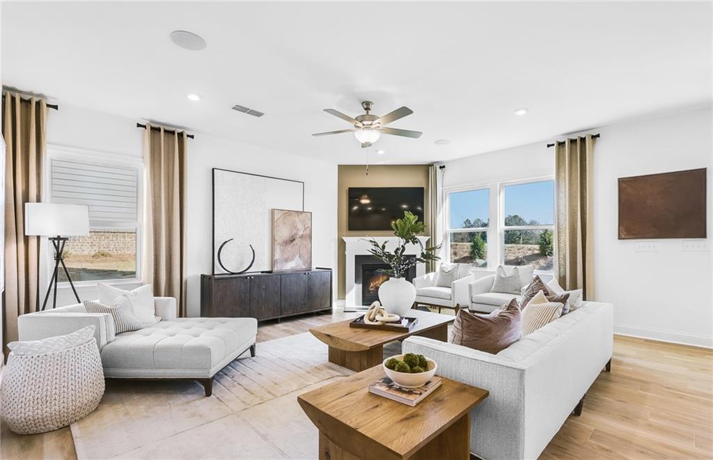 2102 Cayman Court Dacula, GA 30019 - Photo 4 of 18 a living room with furniture and a large window
