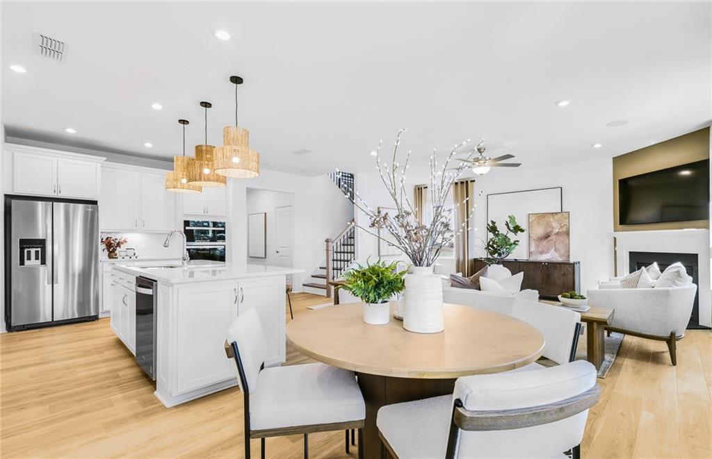 2102 Cayman Court Dacula, GA 30019 - Photo 6 of 18 a view of a dining room with furniture and wooden floor