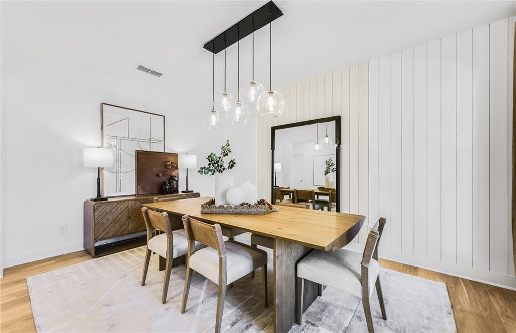 2102 Cayman Court Dacula, GA 30019 - Photo 7 of 18 a view of a dining room with furniture and wooden floor