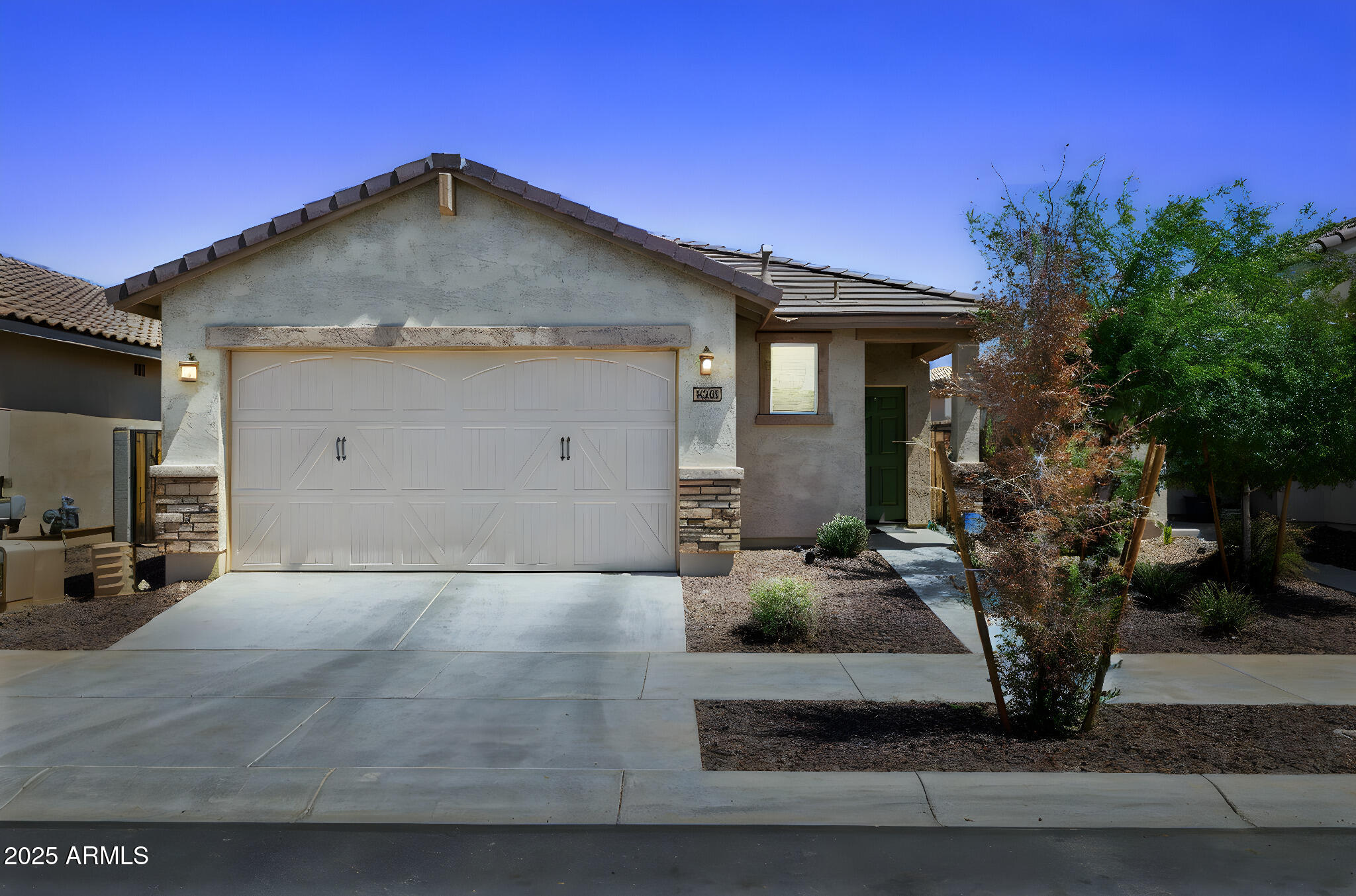 a front view of a house with garage