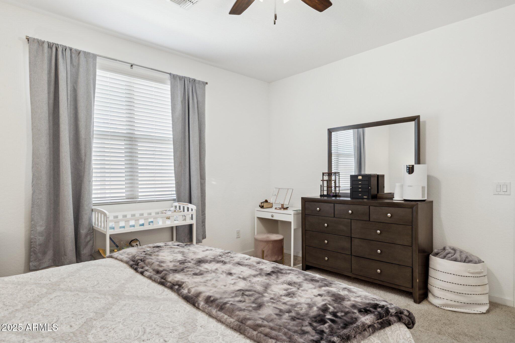 14360 West Pershing Street Surprise, AZ 85379 - Photo 12 of 24 a bedroom with a bed and a window