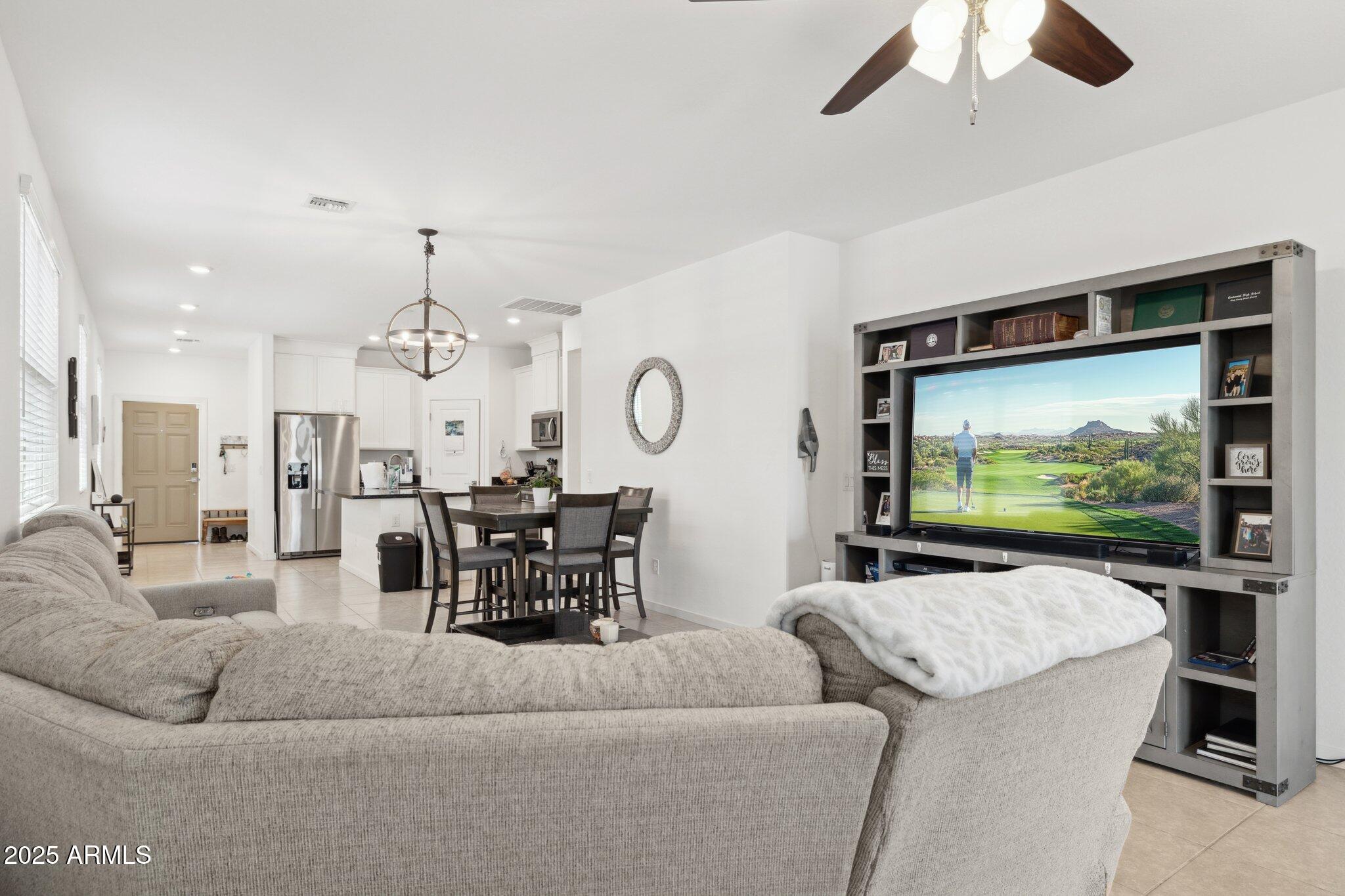 14360 West Pershing Street Surprise, AZ 85379 - Photo 5 of 24 a living room with furniture and a flat screen tv