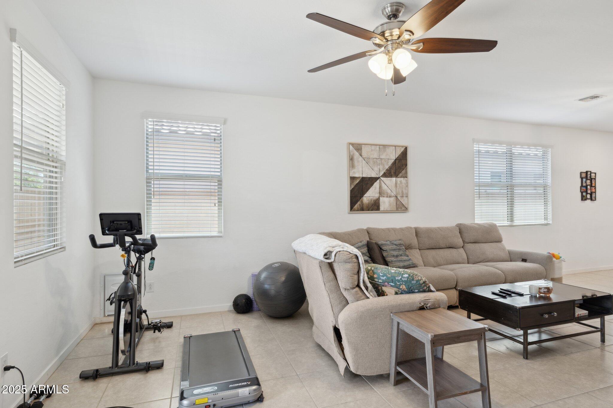 14360 West Pershing Street Surprise, AZ 85379 - Photo 7 of 24 a living room with furniture and a window