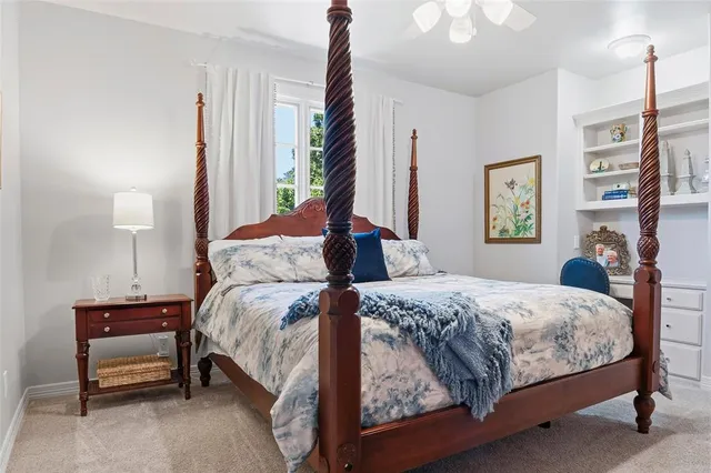 a bedroom with bed and a window