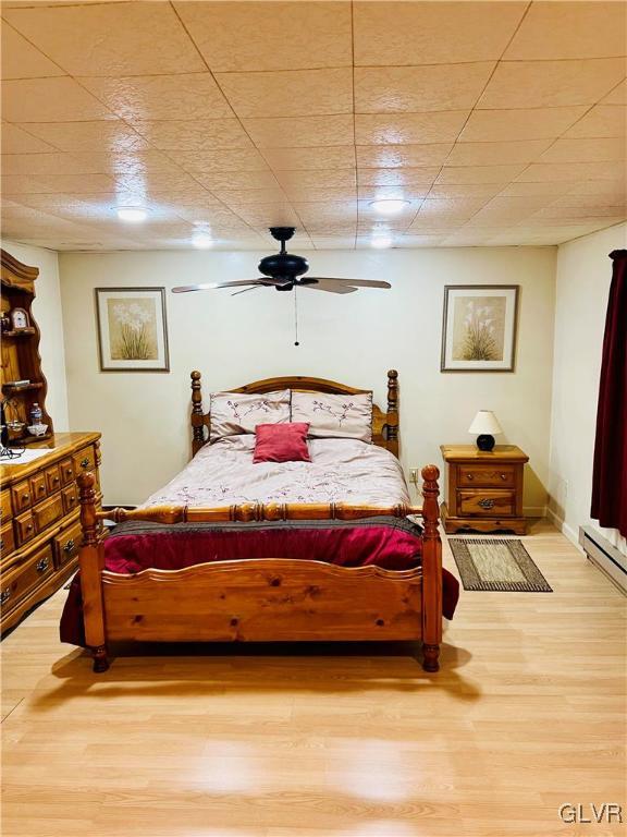 1466 Bushkill Center Road Nazareth, PA 18064 - Photo 23 of 26 a bedroom with a bed and wooden floor