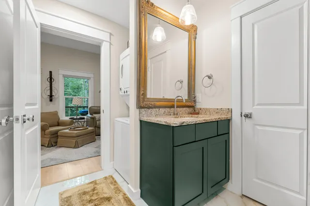 a en suite bathroom with a sink and a mirror