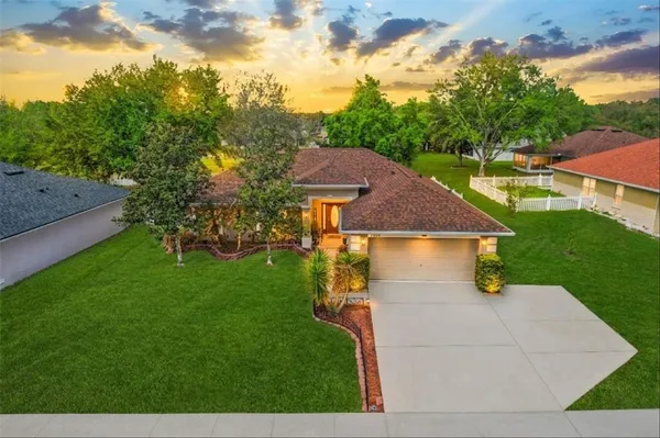 a view of house with backyard