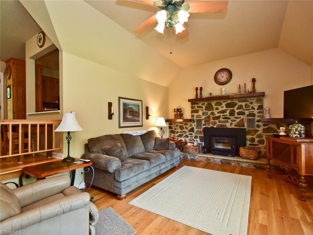 A great fire place with a wood stove... Wood Floors