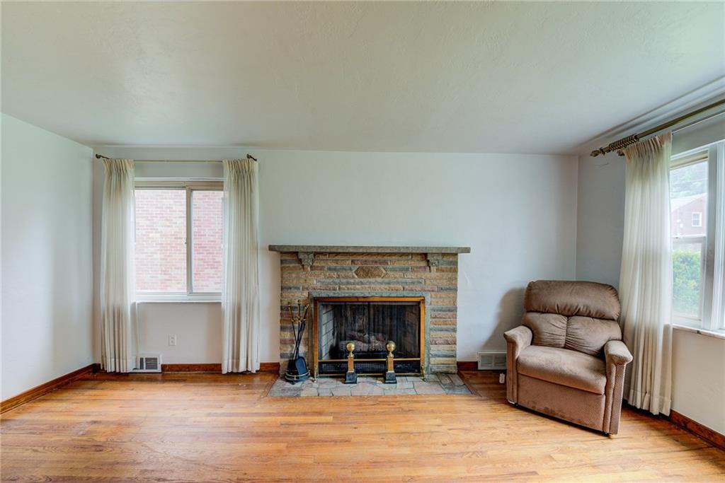 3723 Oakton Road Pittsburgh, PA 15227 - Photo 4 of 25 LIVING ROOM HAS HANDSOME STONE FIRE PLACE