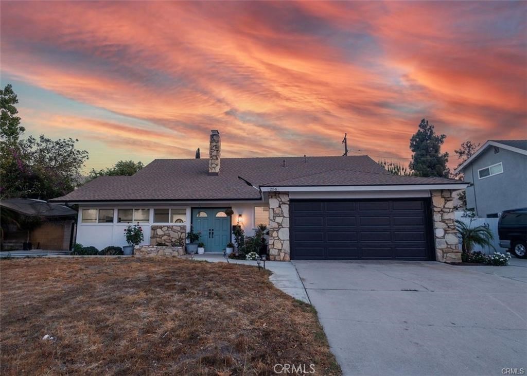 a front view of a house with a garage
