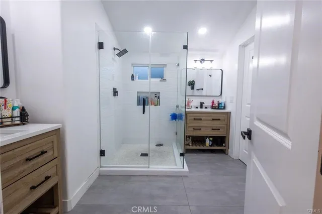 a bedroom with bed chair and window