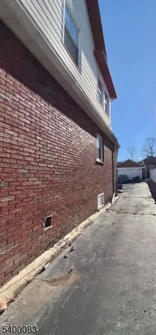 a view of a brick house with an outdoor space