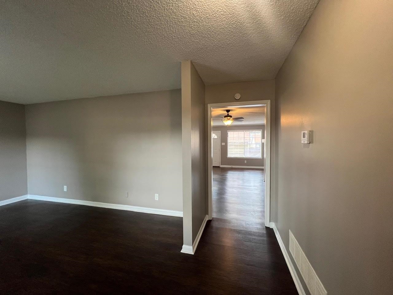 5995 Lofty Oak Road, Unit 5995 Memphis, TN 38115 - Photo 16 of 20 Hallway with dark wood-type flooring and a textured ceiling