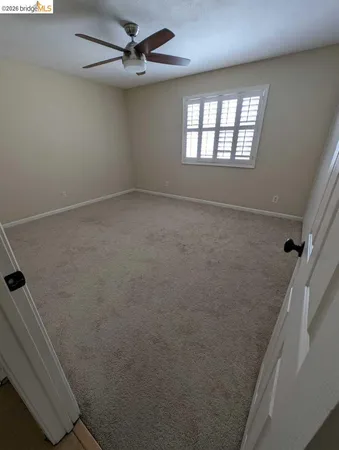 a view of empty room with windows