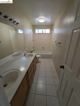 a bathroom with a sink a vanity and a mirror