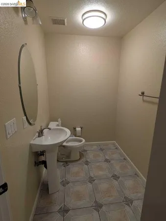 a bathroom with a sink and mirror