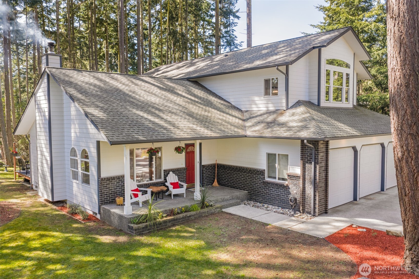 31 Josephine Place Sequim, WA 98382 - Photo 1 of 40 a view of a house with a patio and backyard