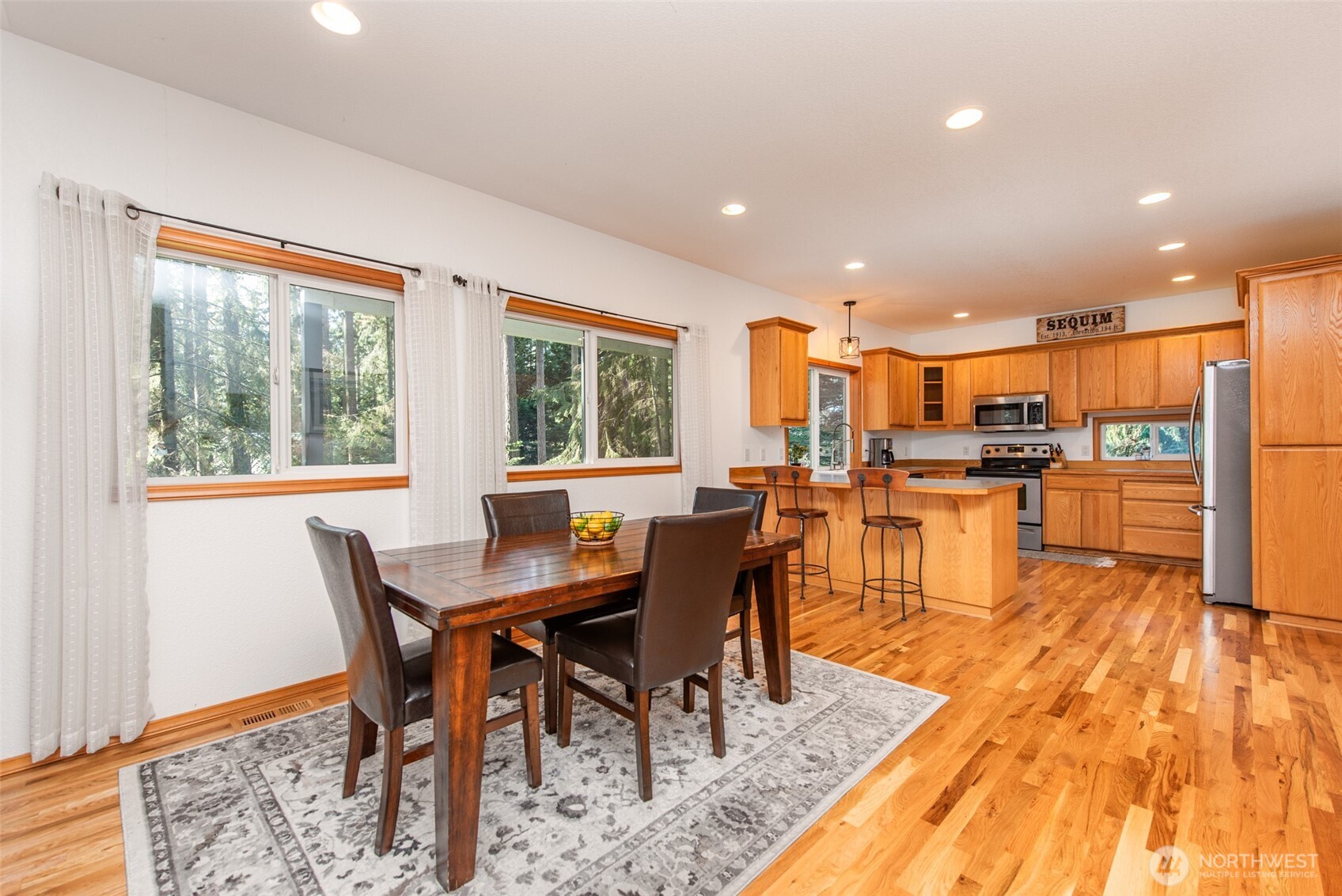 31 Josephine Place Sequim, WA 98382 - Photo 12 of 40 a view of a dining room with furniture window and wooden floor