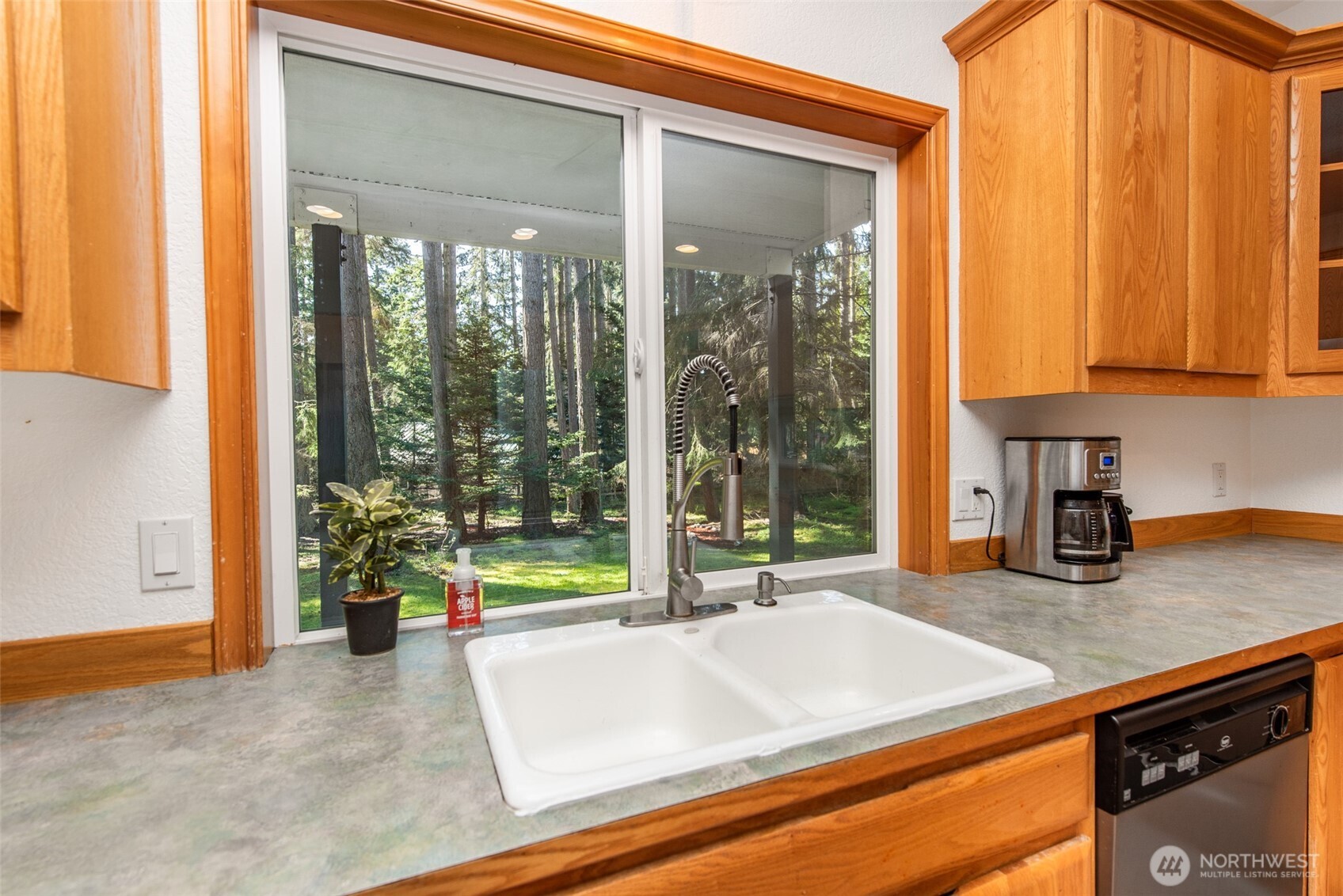 31 Josephine Place Sequim, WA 98382 - Photo 14 of 40 a kitchen with a sink and a large window