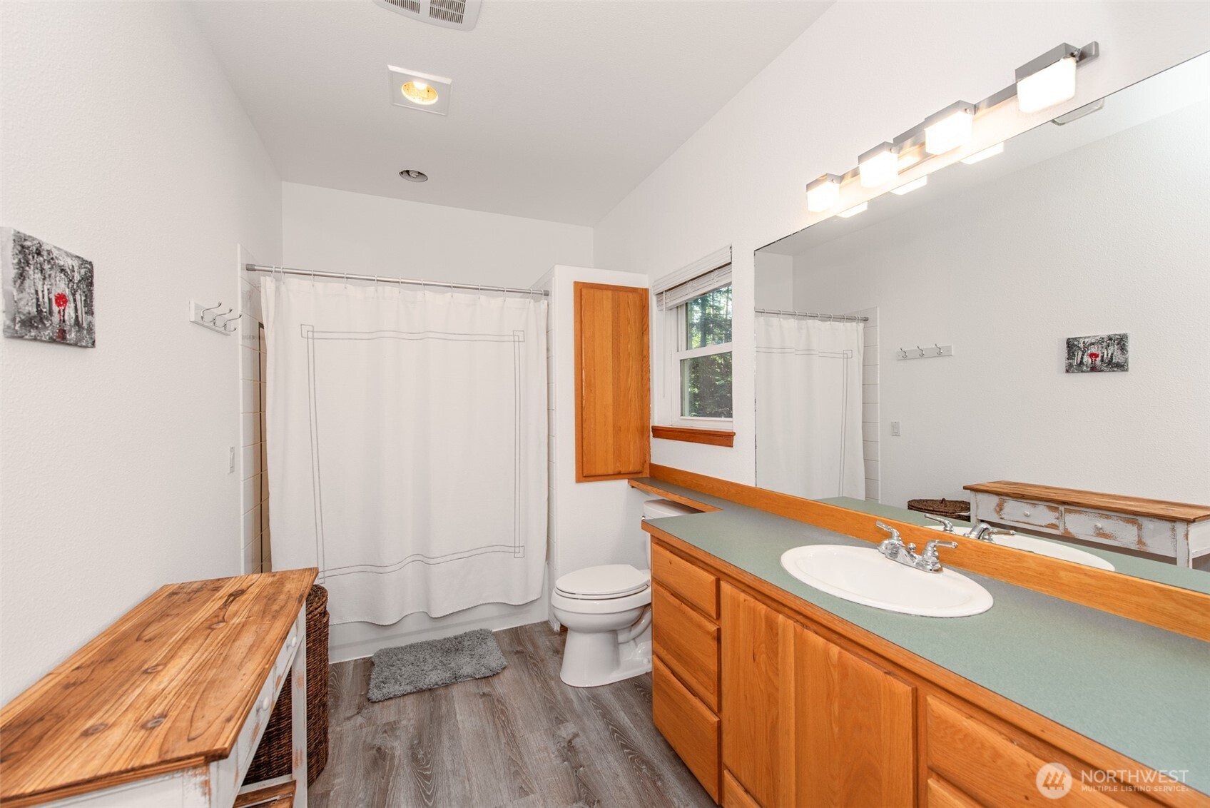 31 Josephine Place Sequim, WA 98382 - Photo 20 of 40 a bathroom with a sink a toilet a mirror and shower