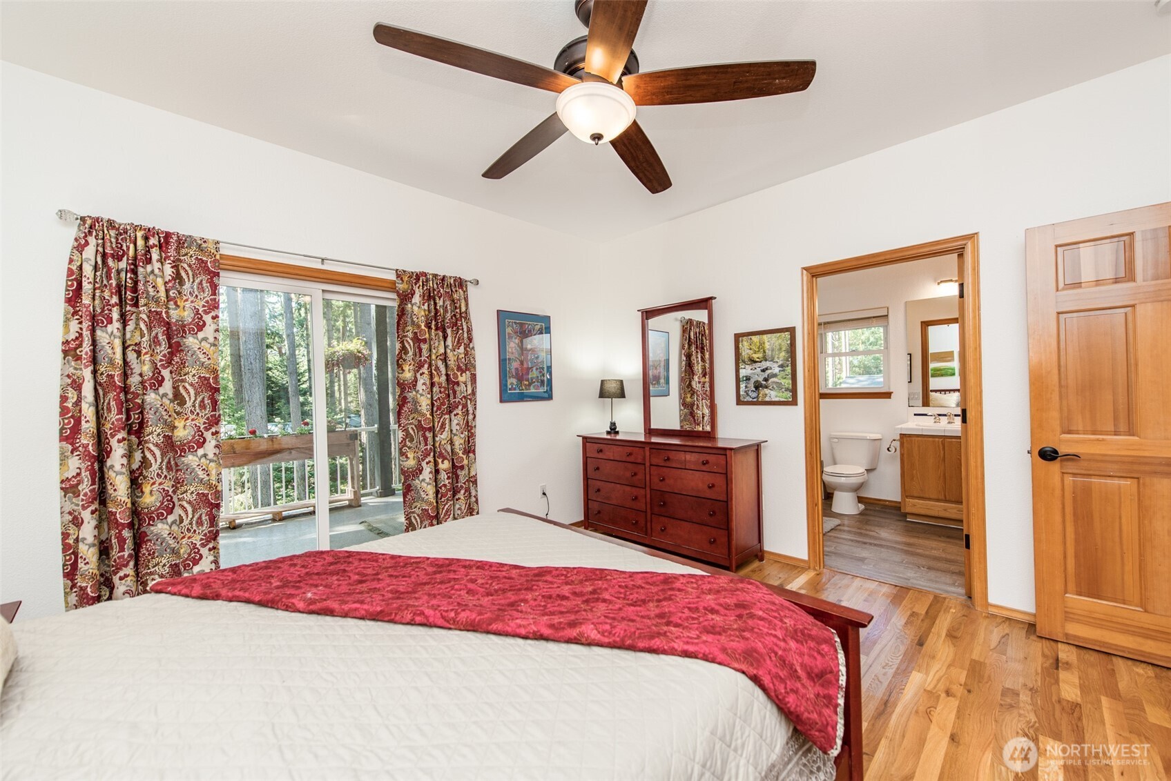 31 Josephine Place Sequim, WA 98382 - Photo 22 of 40 a bedroom with a large bed and a chandelier