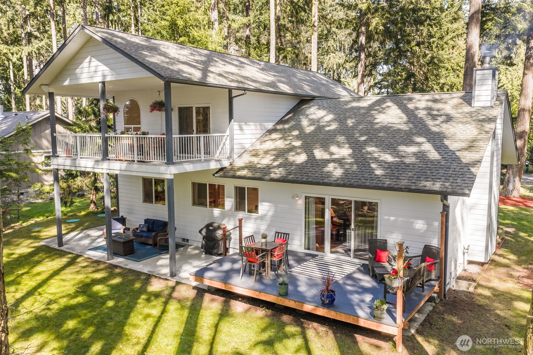 31 Josephine Place Sequim, WA 98382 - Photo 3 of 40 a view of a house with pool and chairs