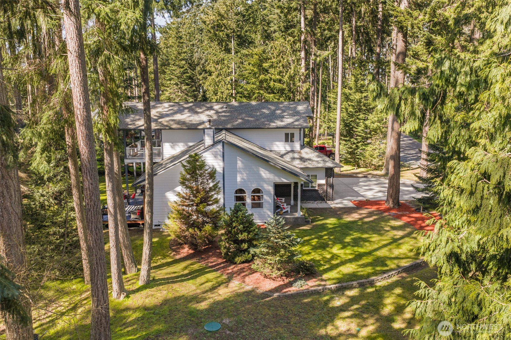 31 Josephine Place Sequim, WA 98382 - Photo 37 of 40 a view of a house with a small yard and large tree