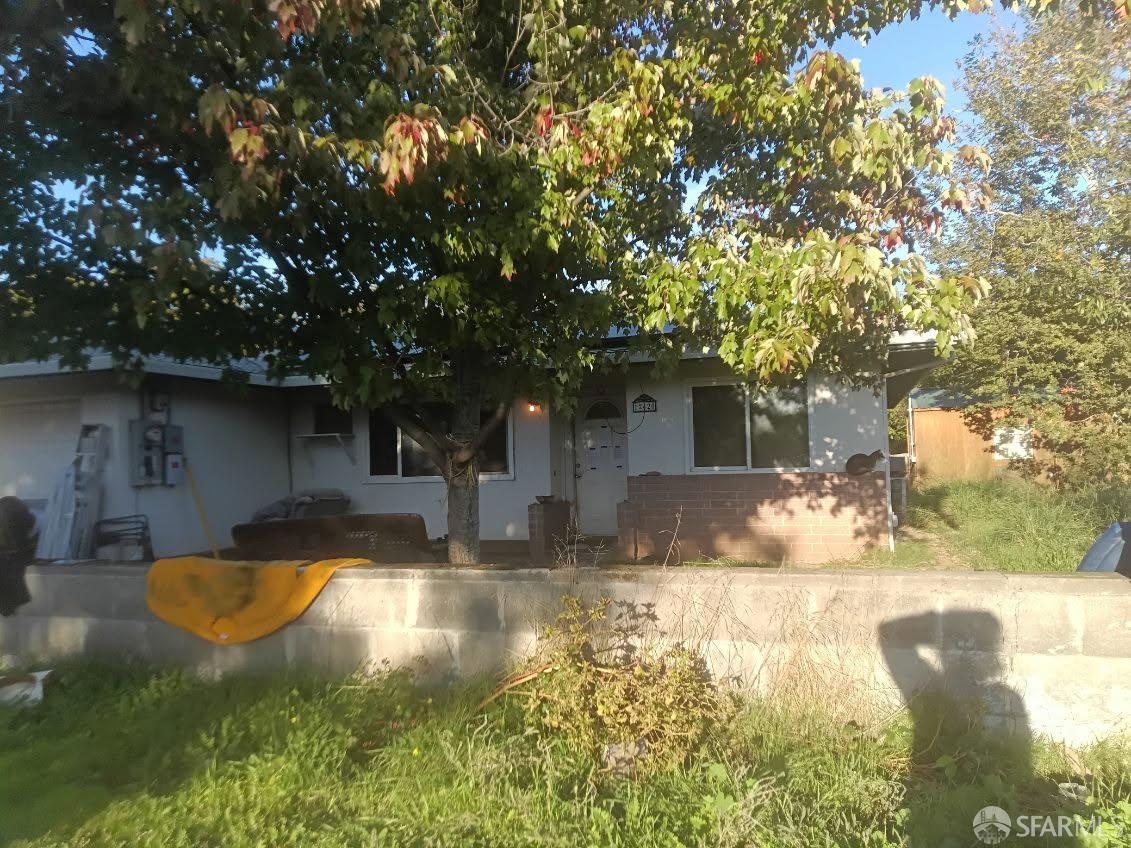 a swimming pool with outdoor seating and yard