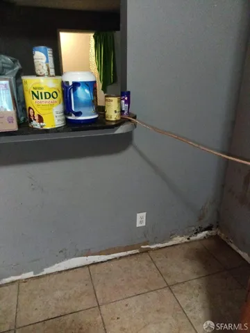 a view of walk in closet with clothes