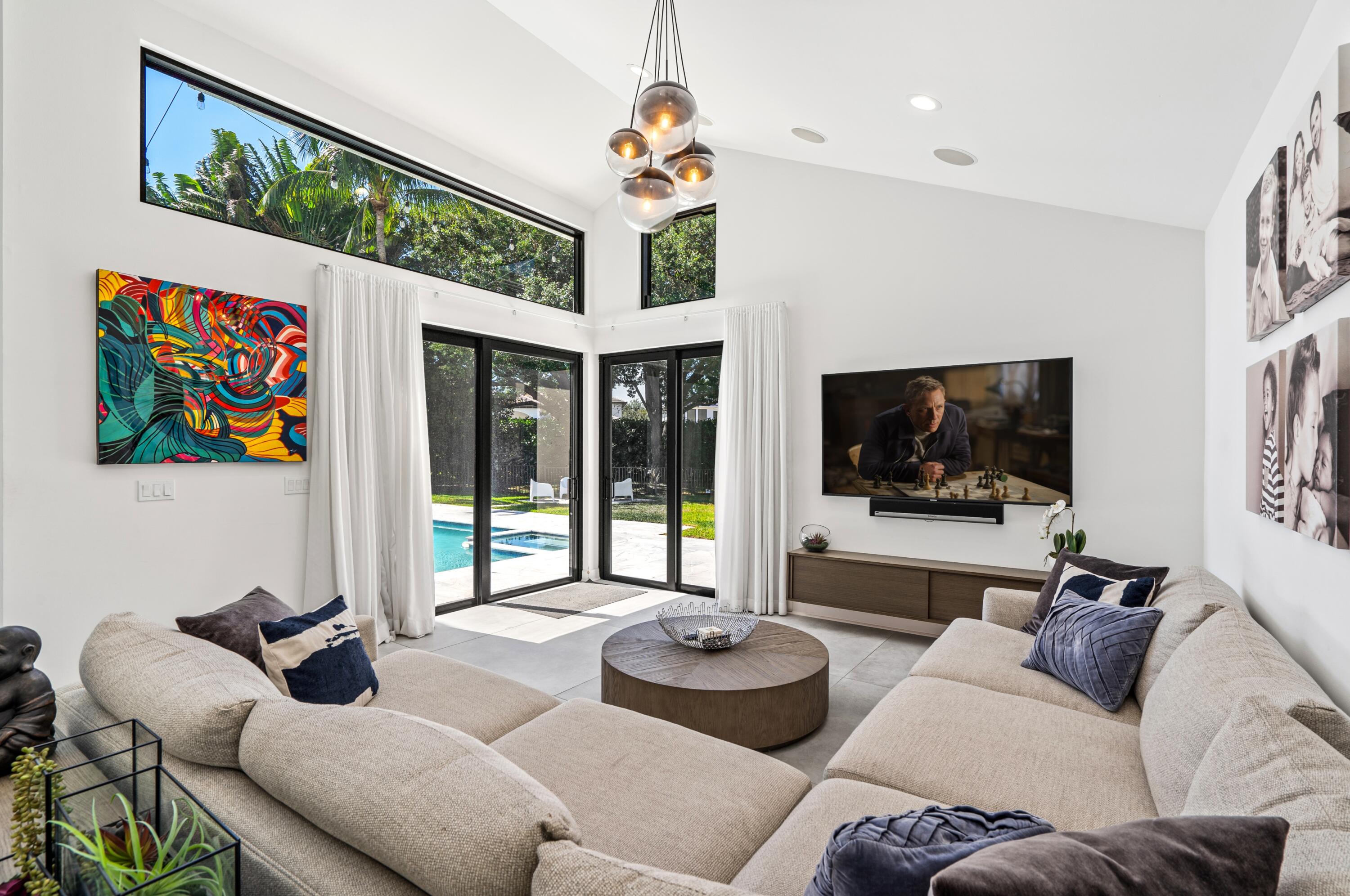 3098 Northwest 60th Street Boca Raton, FL 33496 - Photo 11 of 30 a living room with furniture and a flat screen tv