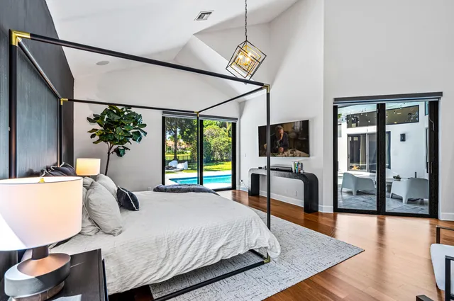 a bathroom with a granite countertop sink mirror and bathtub