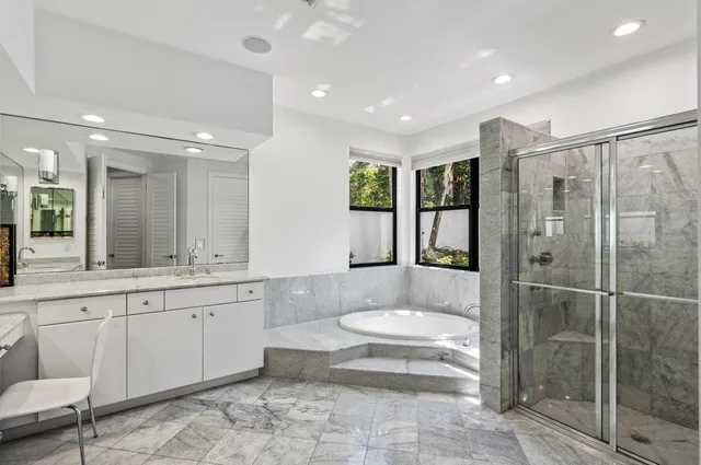 a view of a workspace with furniture and wooden floor