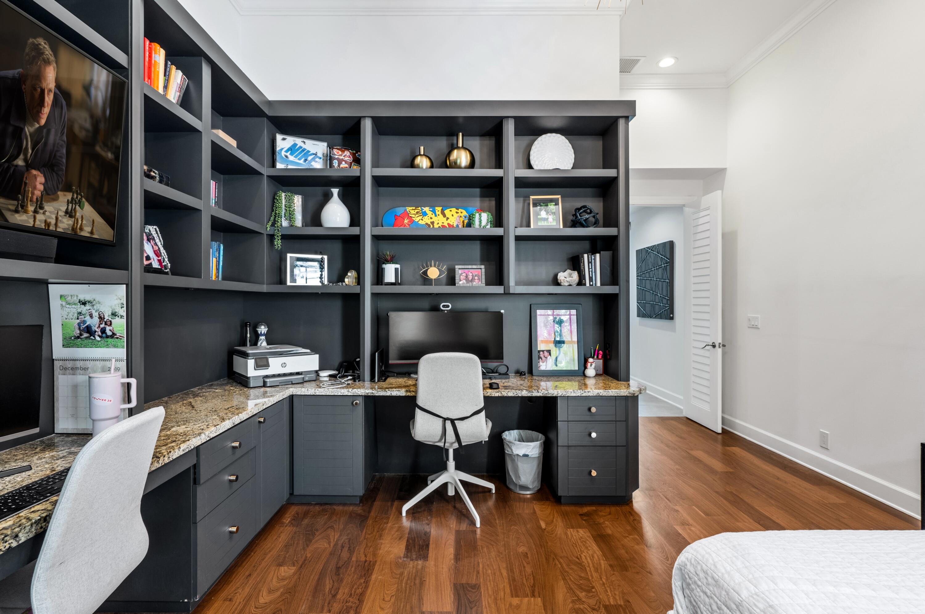 3098 Northwest 60th Street Boca Raton, FL 33496 - Photo 17 of 30 a view of a workspace with furniture and wooden floor