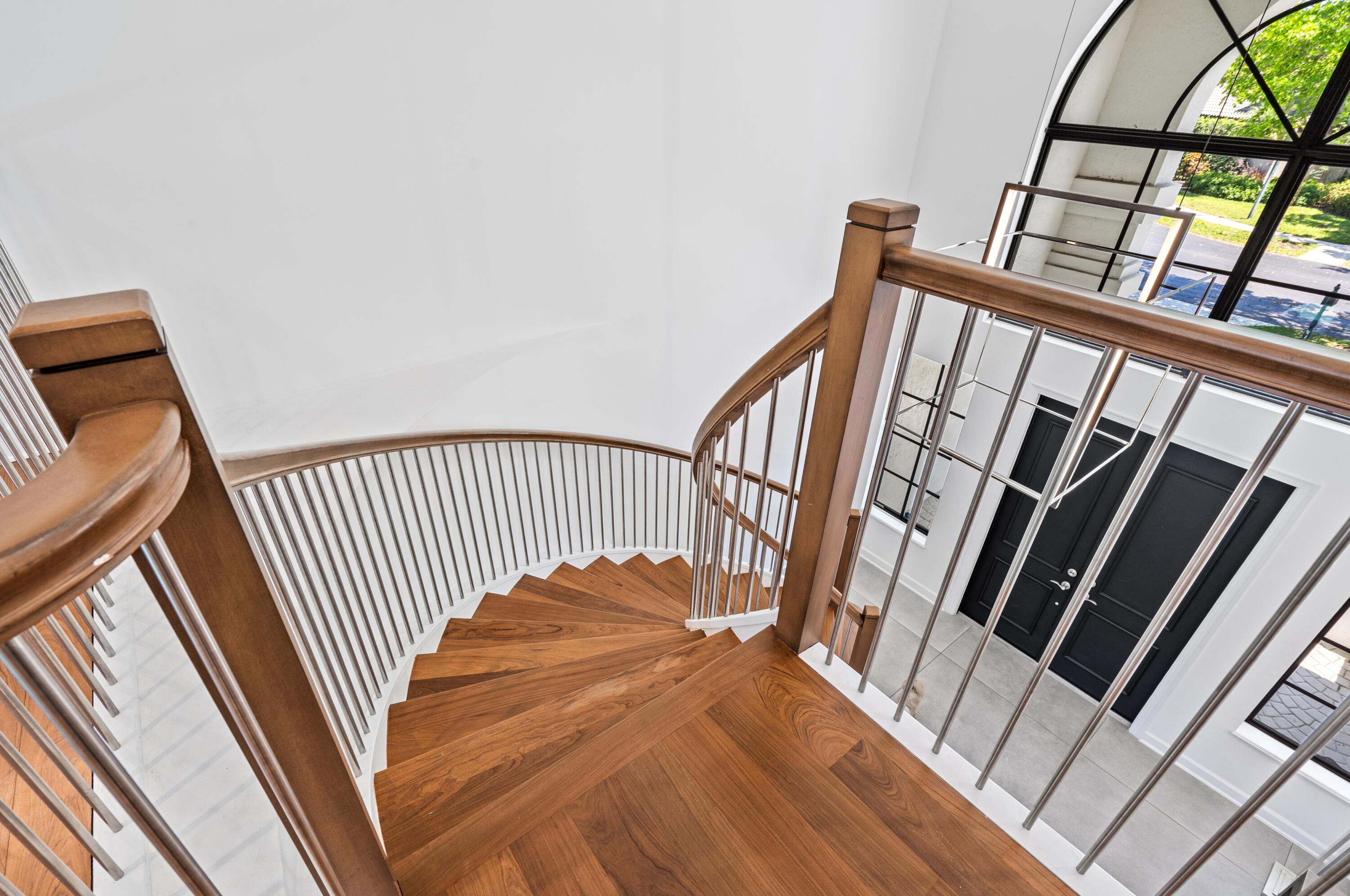 3098 Northwest 60th Street Boca Raton, FL 33496 - Photo 20 of 30 a view of staircase with railing and white walls
