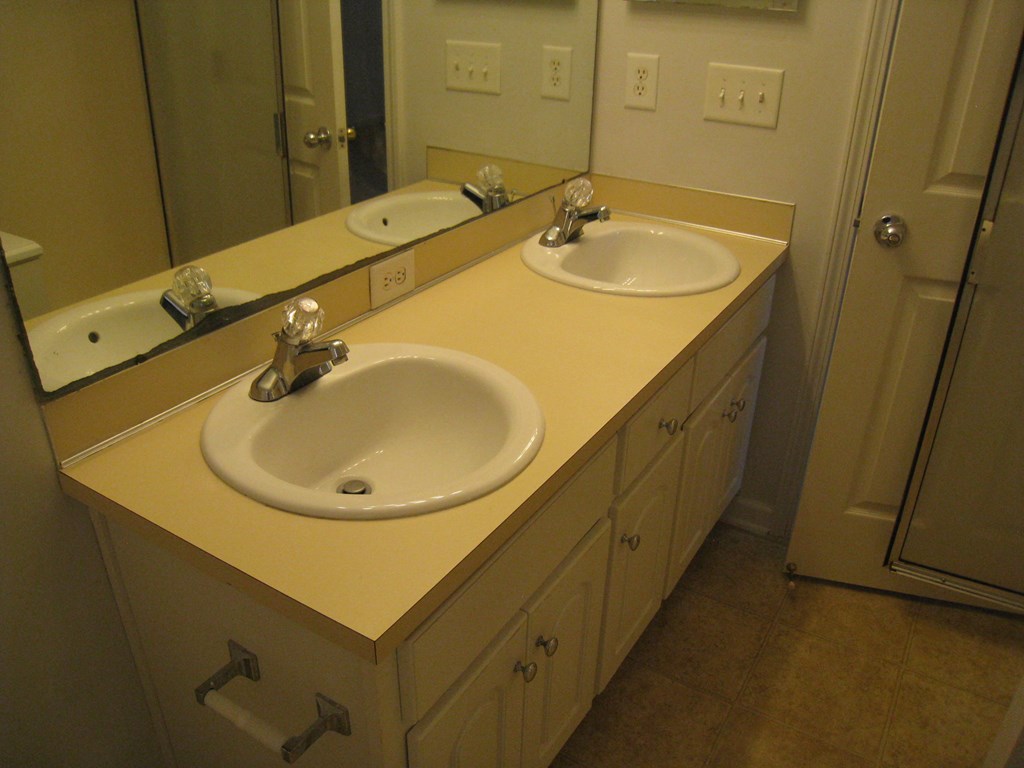 3371 Flintlock Drive Columbus, GA 31907 - Photo 11 of 14 a bathroom with a sink and a mirror