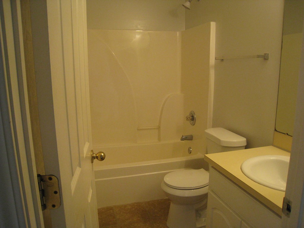 3371 Flintlock Drive Columbus, GA 31907 - Photo 13 of 14 a bathroom with a sink a toilet and shower