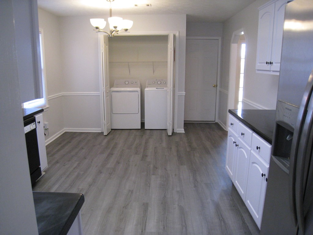 3371 Flintlock Drive Columbus, GA 31907 - Photo 7 of 14 wooden floor in an empty room with a mirror