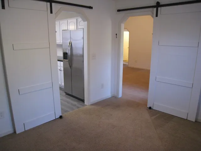a view of a room with a hallway