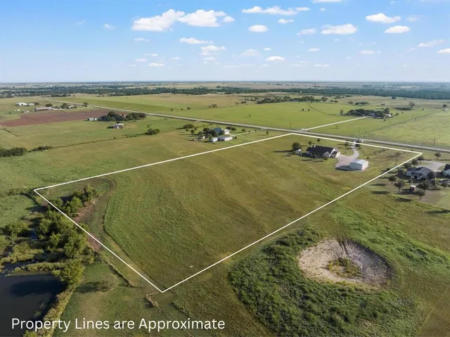 a view of a swimming pool and an outdoor seating
