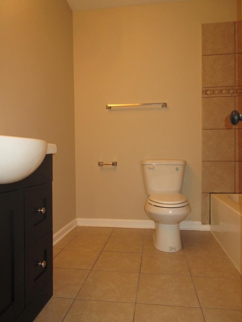 4202 Crain Road Memphis, TN 38128 - Photo 14 of 16 a bathroom with a toilet and a sink