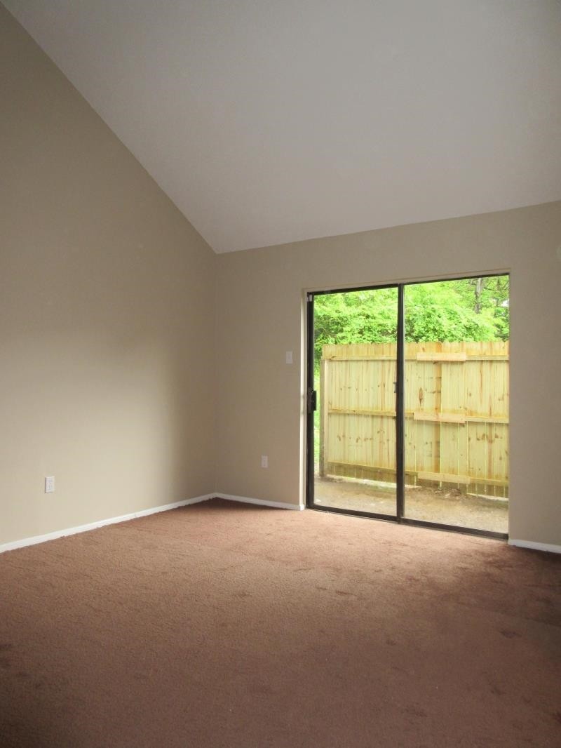 4202 Crain Road Memphis, TN 38128 - Photo 4 of 16 a view of an empty room with a window